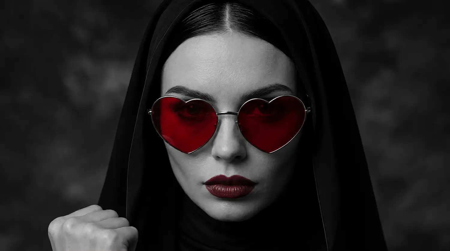 woman wearing heart shaped sun glasses